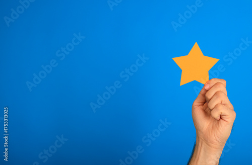 A hand holding a star cut-o...