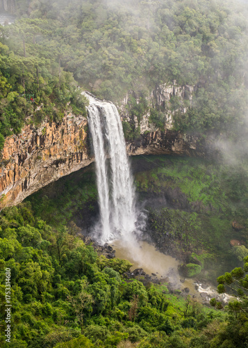 A view of Cascata do Caracol waterfall with fog at Caracol Park - Canela, Brazil