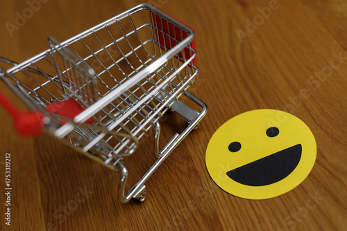 A shopping cart with a smil...