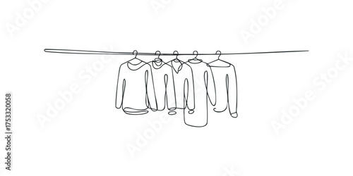 Line drawing of four long-sleeved shirts on a clothesline