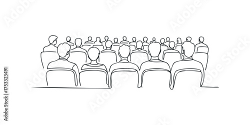 Audience seated in theater watching presentation