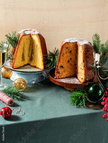 Different types of sweet Italian panettone cakes on a festive Christmas table
