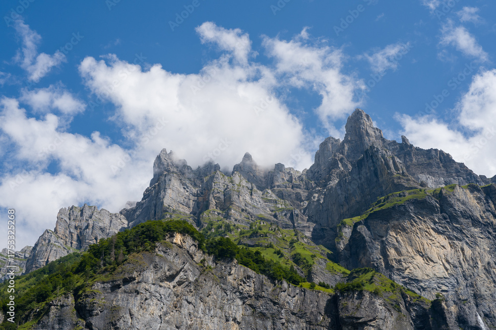 Obraz premium This landscape photo was taken in Europe, France, Auvergne-Rhone-Alpes, Haute-Savoie, Sixt-Fer-a-Cheval, in summer. It shows the cliffs in the Cirque du Fer-a-Cheval, under the Sun.