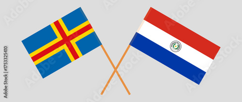 Crossed flags of Aland Islands and Republic of Paraguay. Official colors. Correct proportion. Vector illustration