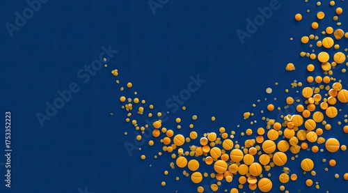 A blue backdrop with golden yellow round tablets and particles forming a curved stream