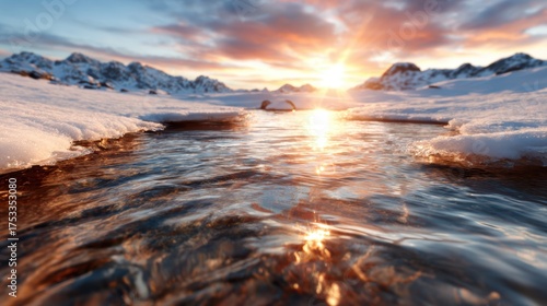A breathtaking sunset illuminating a tranquil, snowy mountain scene, showcasing the perfect harmony of nature at dusk with beautifully reflected light on water.