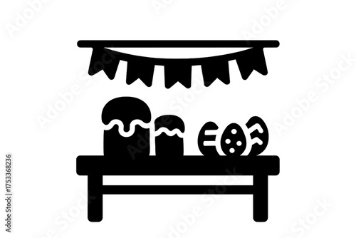 Traditional Easter celebration table setting with kulich cakes and decorated eggs under festive bunting