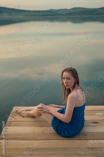 A woman wrapped in a blue t...