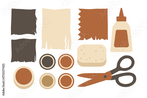 Assortment of crafting materials including paper scraps glue sponge and cutting tool