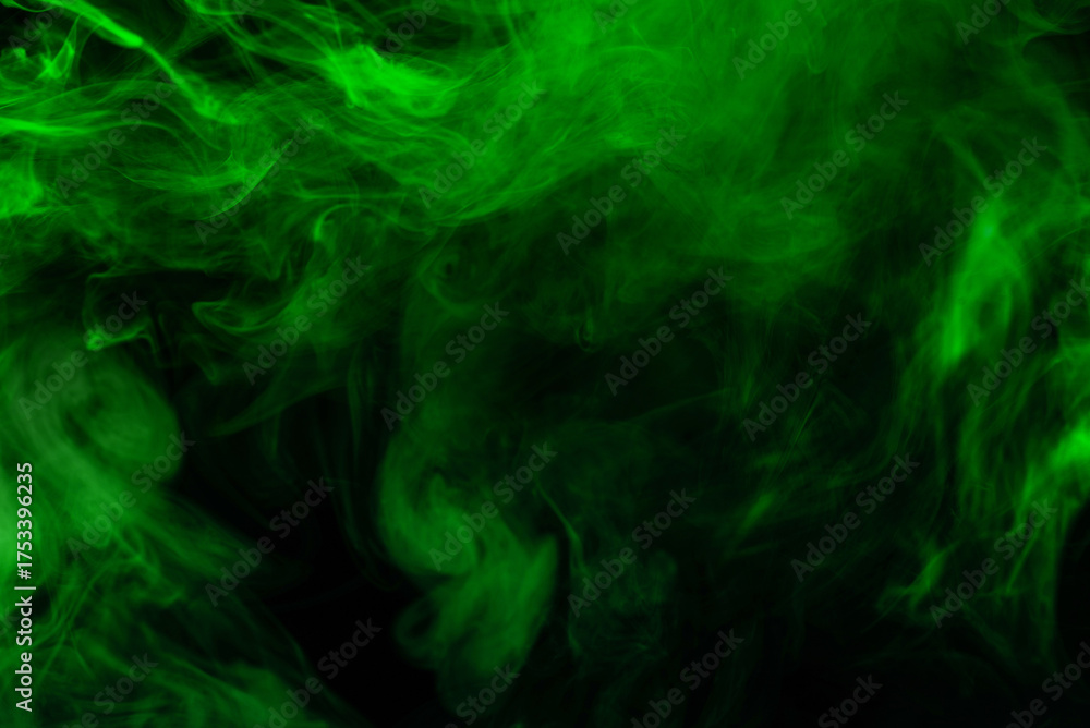 Fototapeta premium Green steam on a black background.