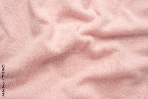 Soft pink cashmere sweater texture background.