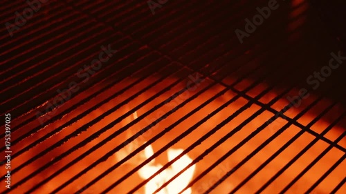 This is an Intense CloseUp of Burning Grill Grates Accompanied by Flames Dancing Around