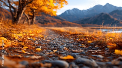 A serene autumn pathway lined with vibrant orange leaves, leading through a tranquil landscape of mountains and nature's beauty, inviting peace and reflection on its journey.