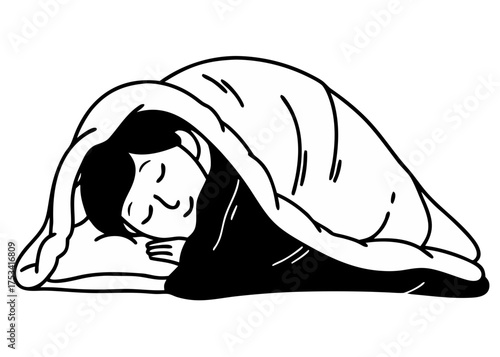 Child sleeping peacefully under a blanket on a bed  