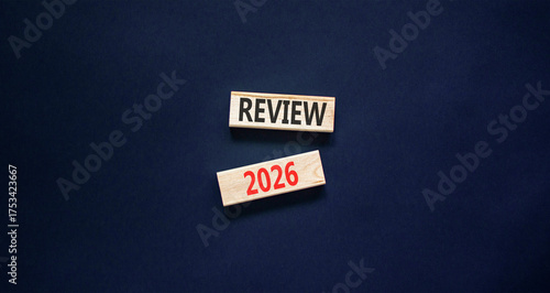 Review 2026 symbol. Concept words Review 2026 on beautiful wooden blocks. Beautiful black paper background. Business and review 2026 concept. Copy space.