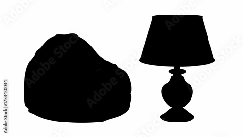 Silhouette of a beanbag chair and a table lamp with a lampshade, both in solid black on a white background
