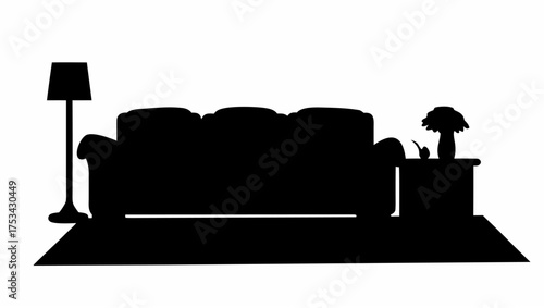 Silhouette of a living room setup with a sofa floor lamp side table and rug creating a cozy interior scene