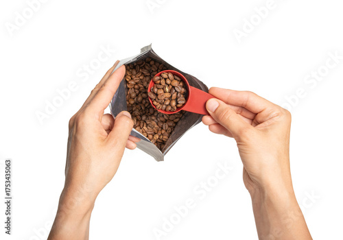 High quality PNG of hands with a pack of coffee and a measuring spoon with a portion of roasted beans on transparent background
