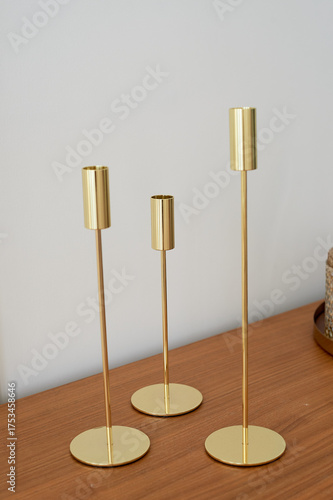 Wallpaper Mural Gold candlesticks of different heights without candles. Minimalist style, Torontodigital.ca