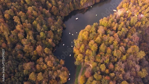 Aerial view of Lake Parz in Dilijan, Armenia during autumn. Beautiful scenic forest landscape with boats on the lake.