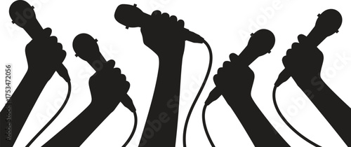 Silhouettes of hands holding microphones raised in the air