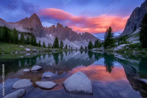 Picturesque reflection of the mountains in the lake during the sunset hour