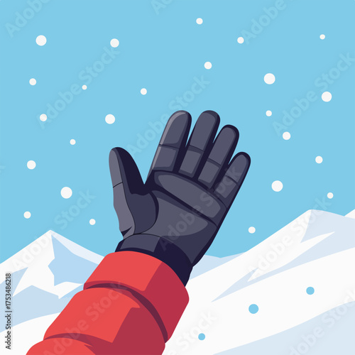 Skier hand in glove reaches up towards sky with falling snow, snowy mountains providing scenic backdrop. Skier hand in glove shows joyful mood,
