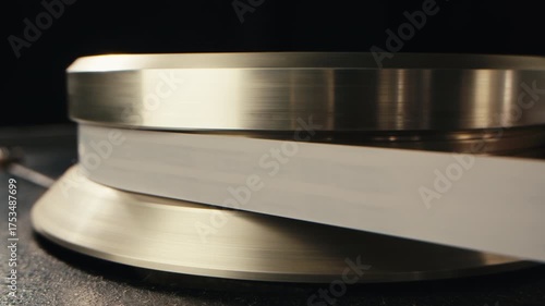 Tape audio music player, studio magnetic tape, vintage retro spool reel to reel player and recorder, magnetic tape data storage close up, music studio. 