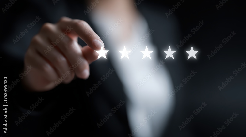 Fototapeta premium Businesswoman indicating a five-star rating on a screen, representing performance evaluation and growth. Rating improvement concept