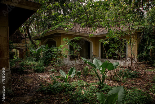 An old abandoned hotel in the jungle. A gloomy atmosphere. A ghost hotel.	
