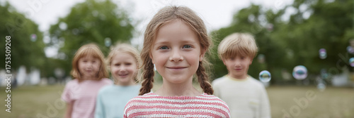 A sprightly Caucasian girl revels in bubble-bliss at a midsummer picnic, embodying whimsical moments of International Children's Day