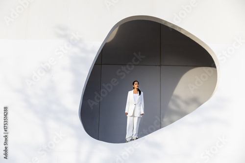 Businesswoman in modern urban architectural setting