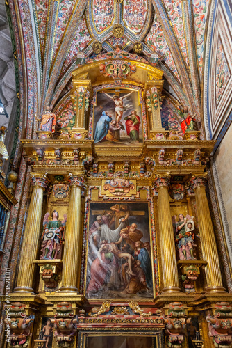 The Segovia Cathedral interior showcases towering Gothic arches and an ornate vaulted ceiling. Massive columns frame the central altarpiece and detailed stained glass