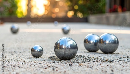 Outdoor petanque balls on a light-colored court