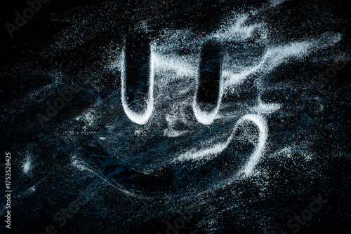 White powder substance spread across table top with a drawn happy face. Concept with medicine and substance abuse and addiction, getting clean.