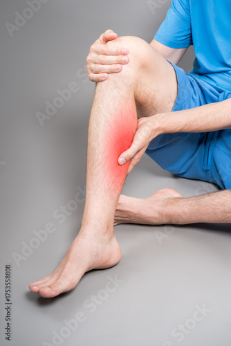 Calf muscle cramped, massage of male leg