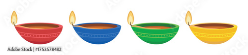 Four colorful clay oil lamps with lit wicks, arranged in a row, symbolizing traditional festive celebrations.