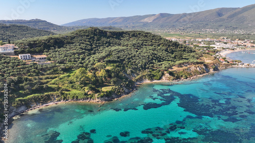 Foto Aerial drone photo of famous seaside village of Alykes featuring popular resort