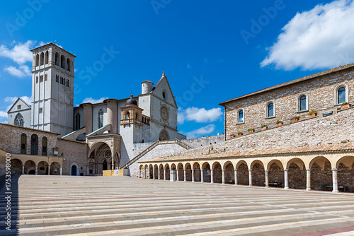 Wallpaper Mural Basilica of St. Francis of Assisi in Umbria, Italy. The stunning architecture of this historical site is highlighted against a bright blue sky on a sunny day. Torontodigital.ca