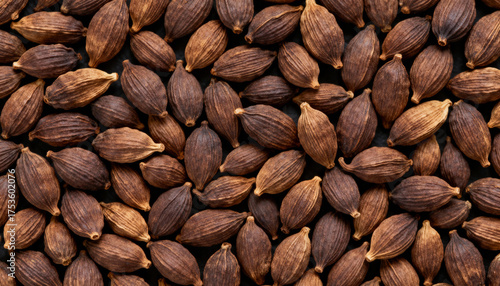 Fototapeta Naklejka Na Ścianę i Meble -  Brown cardamom pods texture with natural pattern closeup background