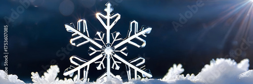 Macro photo of a beautiful snowflake crystal shining in bright sunlight on a snowy surface. Perfect for Christmas cards, winter themes, seasonal backgrounds, holiday banners, and frosty designs