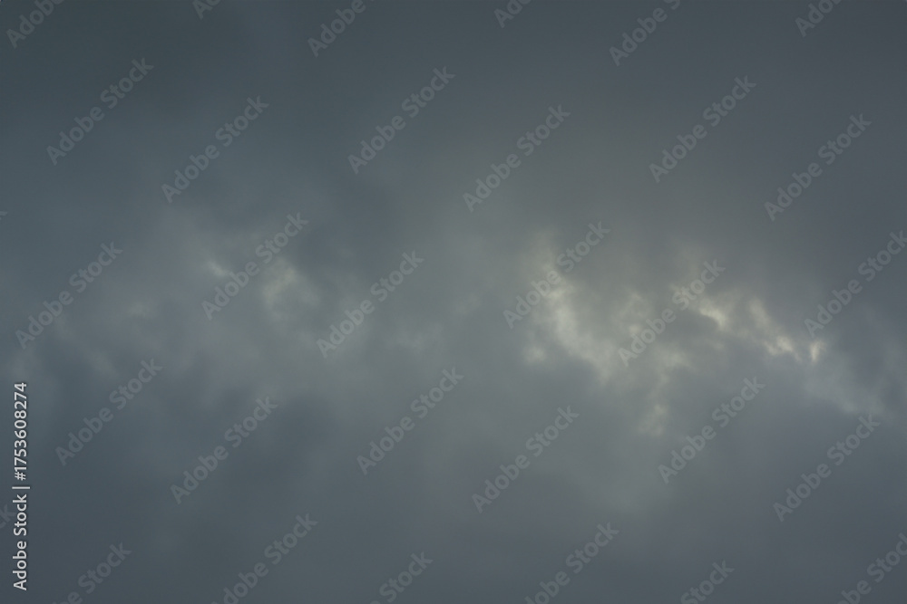 Obraz premium Dark Stormy Sky Background with Heavy Overcast Gray Clouds