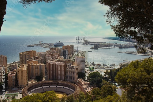 Fotografie Picturesque cityscape of Málaga, Spain's coastal metropolis, showcasing its towering skyscrapers, bustling port, and serene harbor