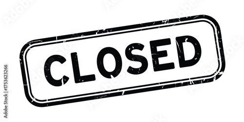 Distressed black and white closed sign with textured border