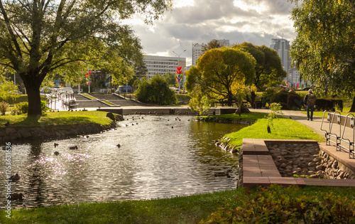 A small pond in the park area of the city . Europe