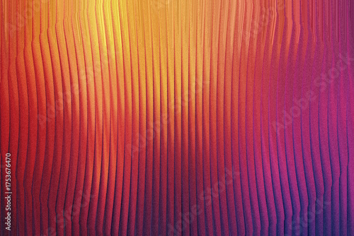 A textured surface displays a smooth gradient from warm yellow and orange to cool pink and purple, with vertical ridges.