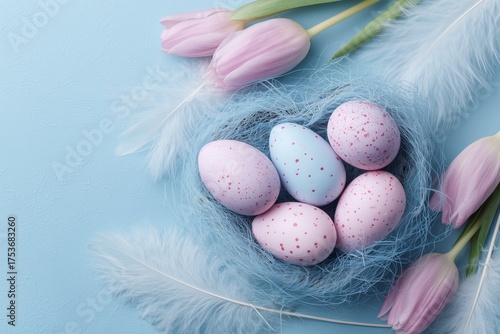 Decorative Easter Eggs in a Nest With Pink Tulips and Soft Feathers
