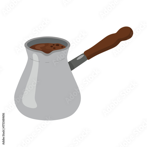Traditional cezve Turkish coffee pot with wooden handle and foam dark brew in metal container