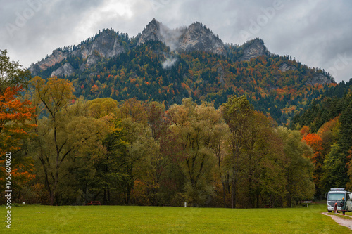 Autumn Landscape of Three Crowns Mountain and Colorful Forest in Pieniny National Park with Parked RVs (Cerveny Klastor Area)