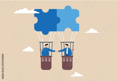 Two businessman handshake on connecting jigsaw balloon